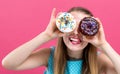 Young woman with donuts