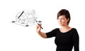 Young woman drawing a house on whiteboard Royalty Free Stock Photo