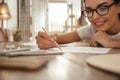 Young woman drawing with pencil at table, focus on hand Royalty Free Stock Photo