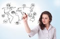 Young woman drawing a social map on whiteboard Royalty Free Stock Photo