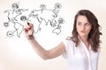 Young woman drawing a social map on whiteboard Royalty Free Stock Photo