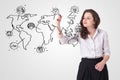 Young woman drawing a social map on whiteboard Royalty Free Stock Photo