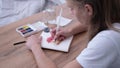 Young woman drawing watercolour picture