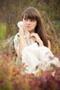 Young woman dreaming among autumn leaves Royalty Free Stock Photo