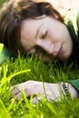 Young woman dreaming in the grass Royalty Free Stock Photo