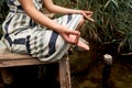 Young woman in dress meditating on the nature