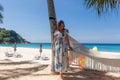 Young Woman in Dress Standing Near Hammock Between Palm Trees Royalty Free Stock Photo