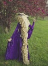 Young woman dressed as the fairy tale character Rapunzel.