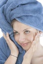 Young woman dressed blue bathrobe Royalty Free Stock Photo