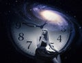 Woman with giant clock and galaxy.