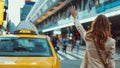 Young woman dressed elegant Business Suit outfit calling yellow taxi cab raising arm gesture in city airport arrival zone. Royalty Free Stock Photo