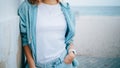 Young woman dressed in white plain t-shirt