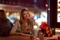 Young woman drining cocktail in restaurant Royalty Free Stock Photo