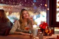 Young woman drining cocktail in restaurant Royalty Free Stock Photo