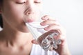 Young woman drinking clean water in her hand. Royalty Free Stock Photo