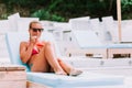 Young woman drinking cocktail in a beach bar Royalty Free Stock Photo