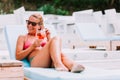 Young woman drinking cocktail in a beach bar Royalty Free Stock Photo