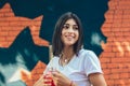 Young woman drinking cocktail in outdoor cafe Royalty Free Stock Photo