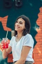 Young woman drinking cocktail in outdoor cafe Royalty Free Stock Photo