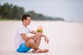 Young woman drinking coconut milk during tropical vacation Royalty Free Stock Photo