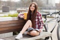 Young woman drinking coffee on a bicycle trip Royalty Free Stock Photo