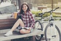 Young woman drinking coffee on a bicycle trip Royalty Free Stock Photo