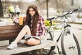 Young woman drinking coffee on a bicycle trip Royalty Free Stock Photo