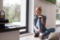 Young woman drinking coffee enjoying relaxing lifestyle Royalty Free Stock Photo