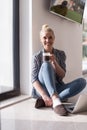 Young woman drinking coffee enjoying relaxing lifestyle Royalty Free Stock Photo