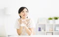 Young Woman drinking coffee in living room Royalty Free Stock Photo