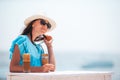 Young woman drinking cold coffee enjoying sea view Royalty Free Stock Photo