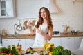 Young woman drinking fresh water from glass in the kitchen. Healthy Lifestyle and Eating. Health, Beauty, Diet Concept Royalty Free Stock Photo