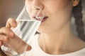 Young woman drinking glass of water close up view Royalty Free Stock Photo