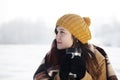 Young woman drinking hot drink outdoors Royalty Free Stock Photo