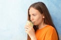 Young woman drinking lemon water Royalty Free Stock Photo