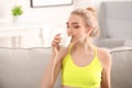 Young woman drinking milk at home. Diet food concept Royalty Free Stock Photo