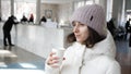 Young woman drinking mineral water from paper Cup Royalty Free Stock Photo