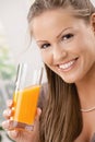 Young woman drinking orange juice Royalty Free Stock Photo