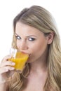 Young Woman Drinking Orange Juice Royalty Free Stock Photo