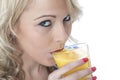 Young Woman Drinking Orange Juice Royalty Free Stock Photo