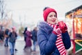 Young woman drinking punch on christmas market Royalty Free Stock Photo