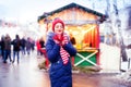 Young woman drinking punch on christmas market Royalty Free Stock Photo