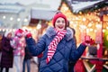 Young woman drinking punch on christmas market Royalty Free Stock Photo