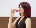 Young woman drinking red wine Royalty Free Stock Photo