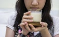 Young woman drinking soybean milk