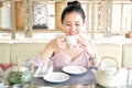 Young woman drinking tea in the morning Royalty Free Stock Photo