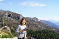 Young woman drinking tea in the mountains Royalty Free Stock Photo