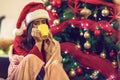 . woman drinking from tea mug at Christmas eve