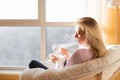 Woman drinking tea while relaxing at home Royalty Free Stock Photo