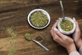 Young woman drinking traditional Argentinian yerba mate tea.